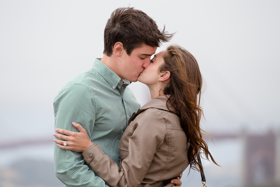 Romantic, soft color Baker Beach engagement photo just after surprise marriage proposal - San Francisco