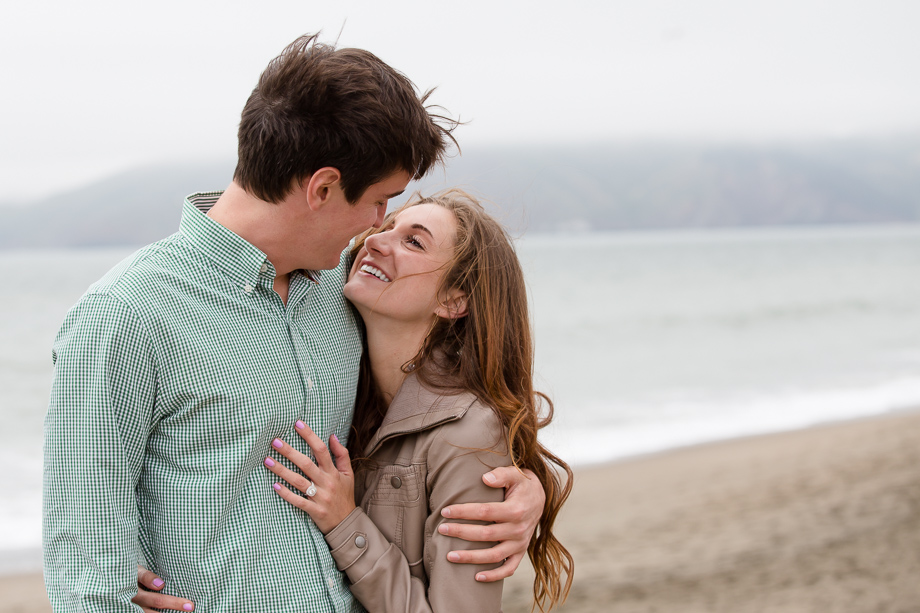 Romantic, soft color Baker Beach surprise marriage proposal photo - San Francisco