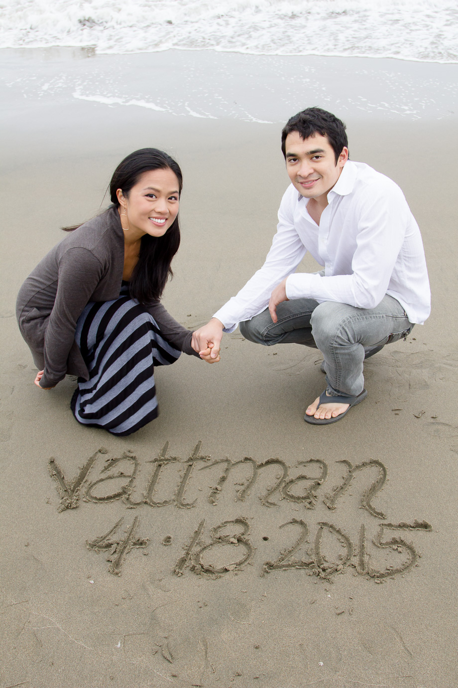 Save the Date written into beach sand - Matt and Van are engaged and getting married!
