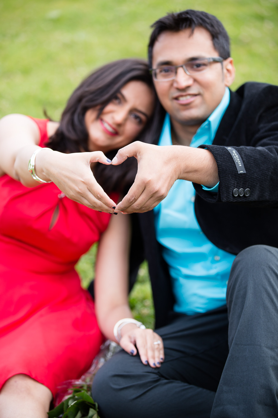 Mini-engagement session photo with hands forming a heart