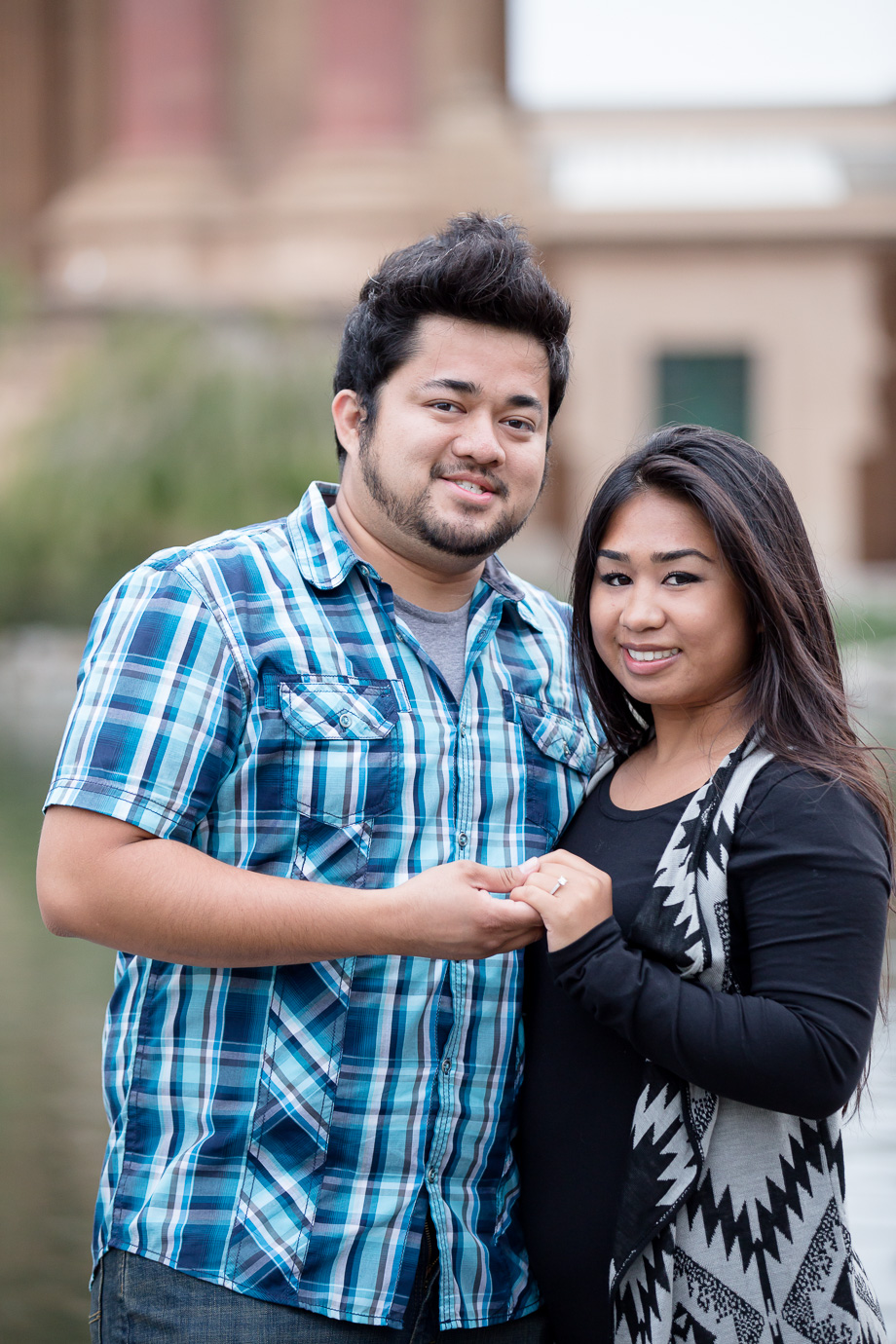 The happy couple showing off their new ring after a successful marriage proposal