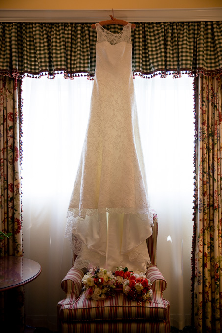 Wedding dress hanging in front of the window at Stanford Park Hotel