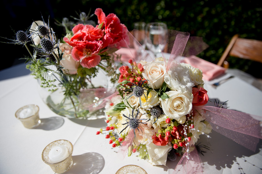 Beautiful floral table centerpiece at wedding reception at Ladera Oaks