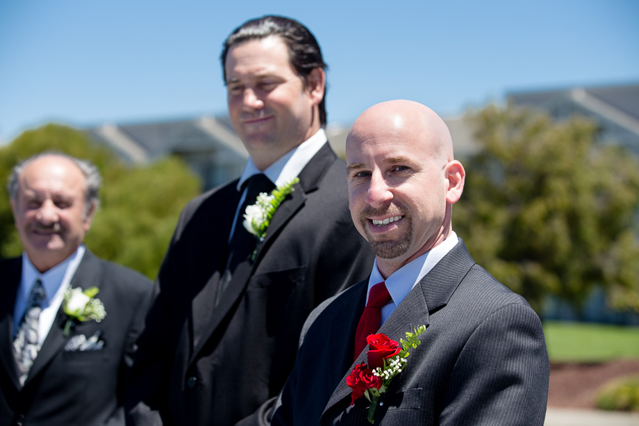 the groom and his best man awaiting the brides entrance to the wedding ceremony