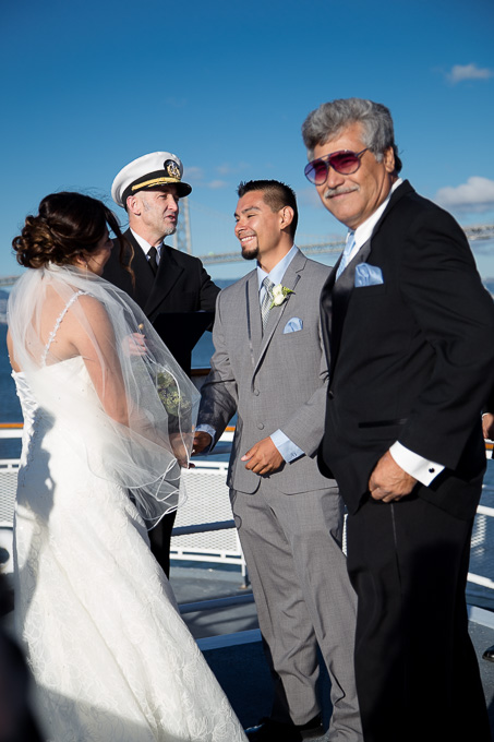 Bride, groom, and captain getting in position for the ceremony