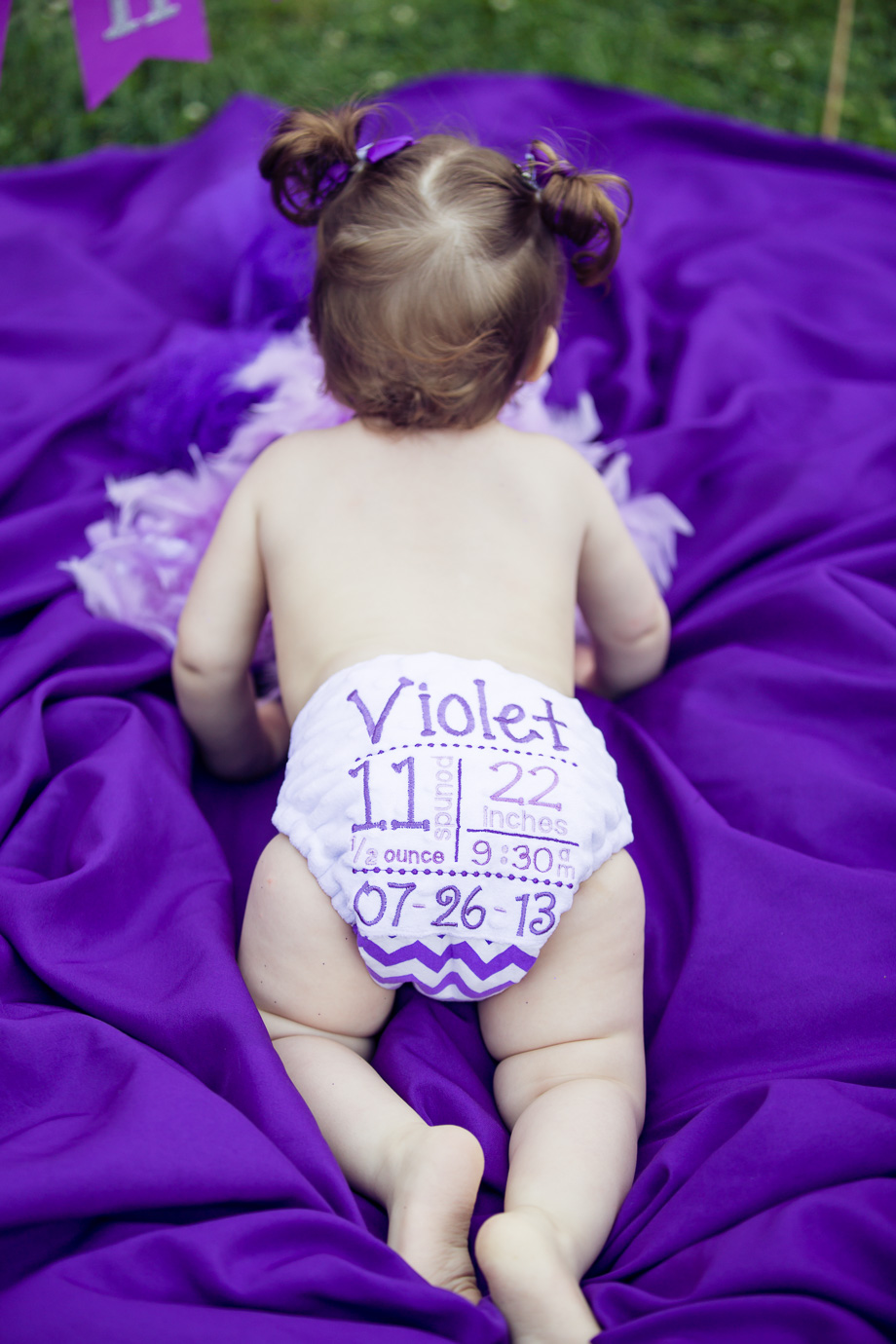 Violets cute diaper with her birthday written on it