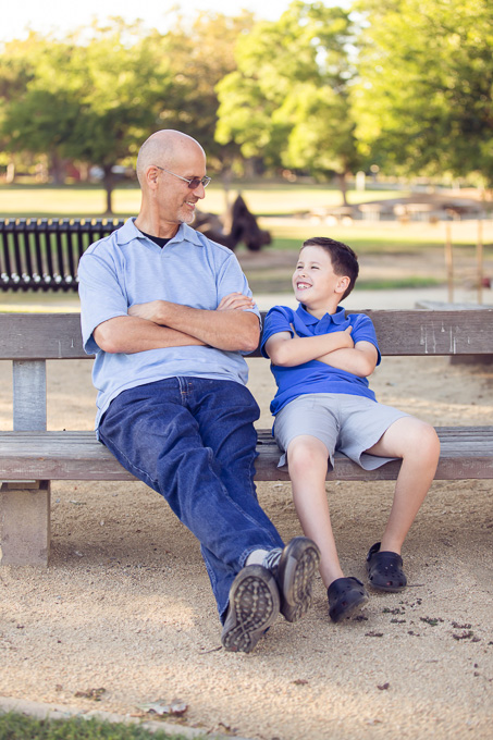 Father and son bonding on a bench at Mitchell Park in Palo Alto