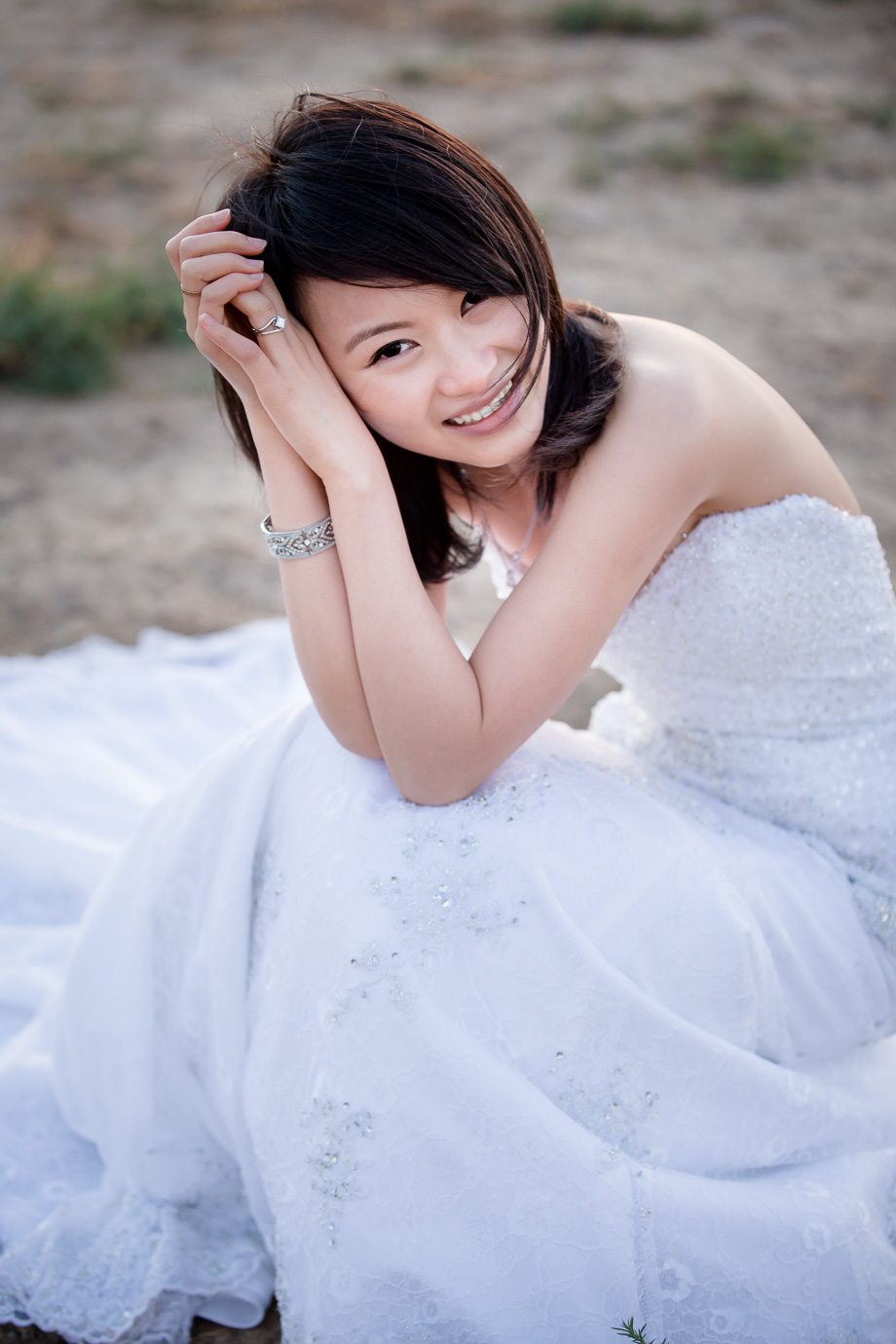 beautiful Asian bridal portrait at park in white wedding dress