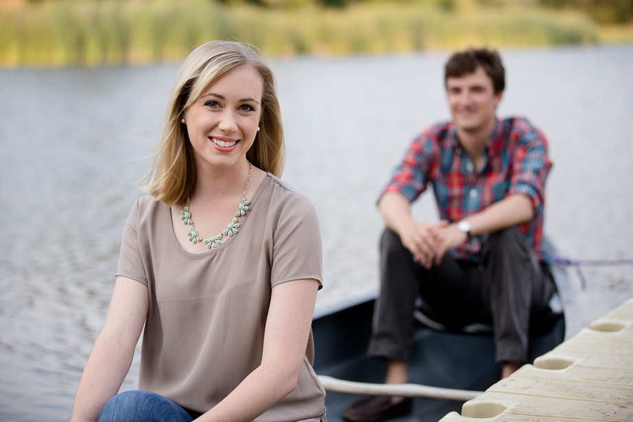 Couple sitting inside a small rowboat on a lake in Palo Alto