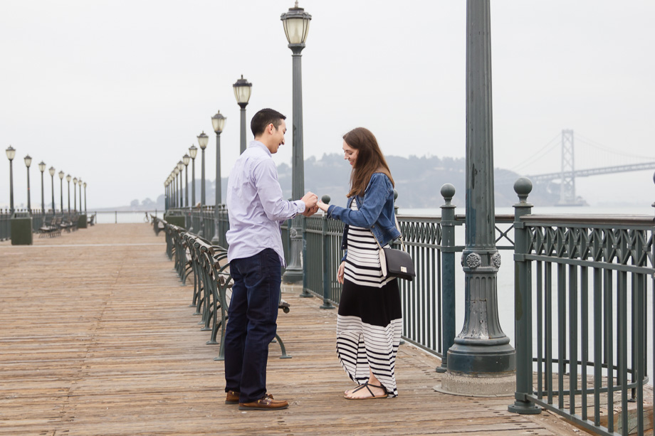 Putting on the ring for her at Pier 7, Embarcadero
