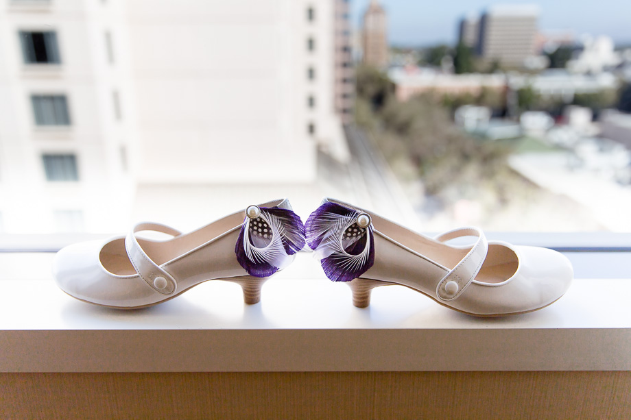 Cute little wedding shoes with the clipped-on purple feathers