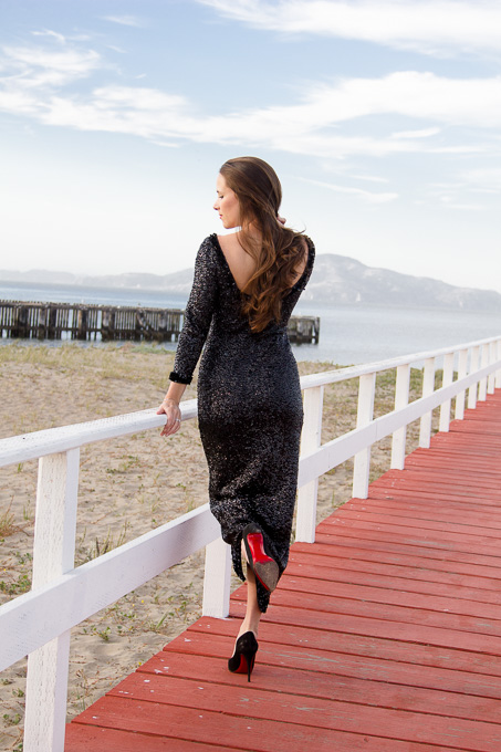 Aubrianna standing on the Crissy Field boardwalk showing off the back of her the family heirloom - grandmothers dress