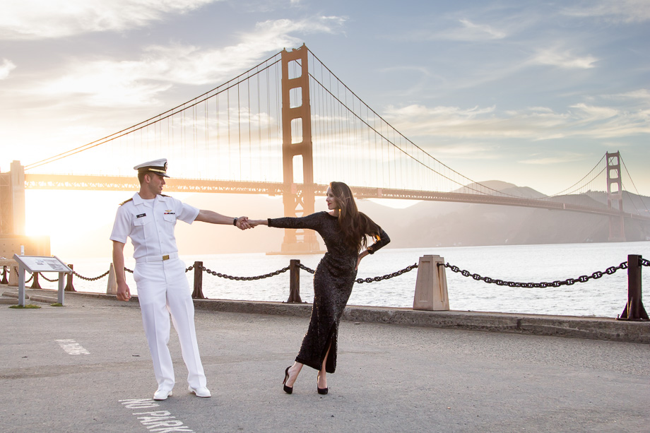 Romantic photo of couple dancing in front of the Golden Gate Bridge during a summer sunset