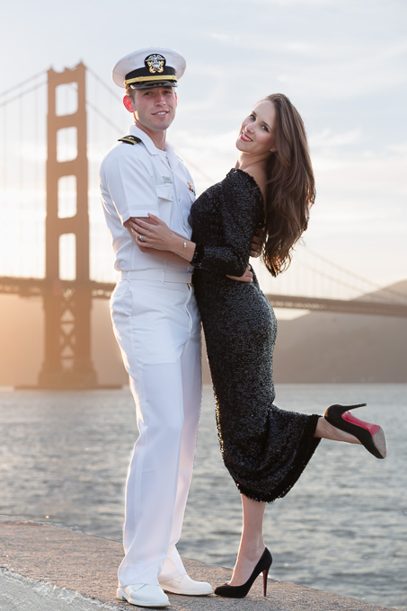 Beautiful couple standing in front of the San Francisco Golden Gate Bridge for engagement portraits