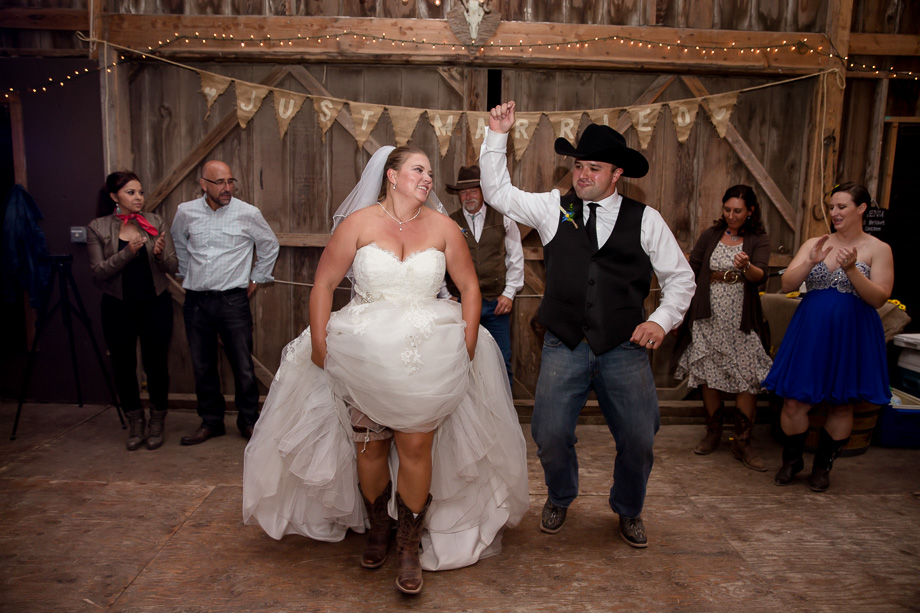 Bride and groom dancing with guests