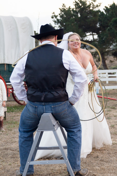 Bride capturing the groom with a rope lasso