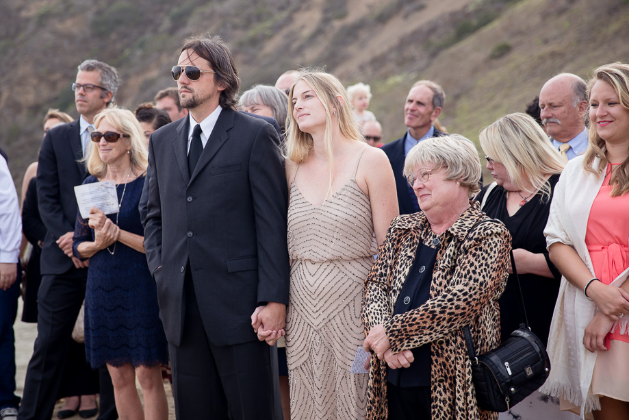 Friends and family are gathered at Mavericks Surf Break for the wedding ceremony