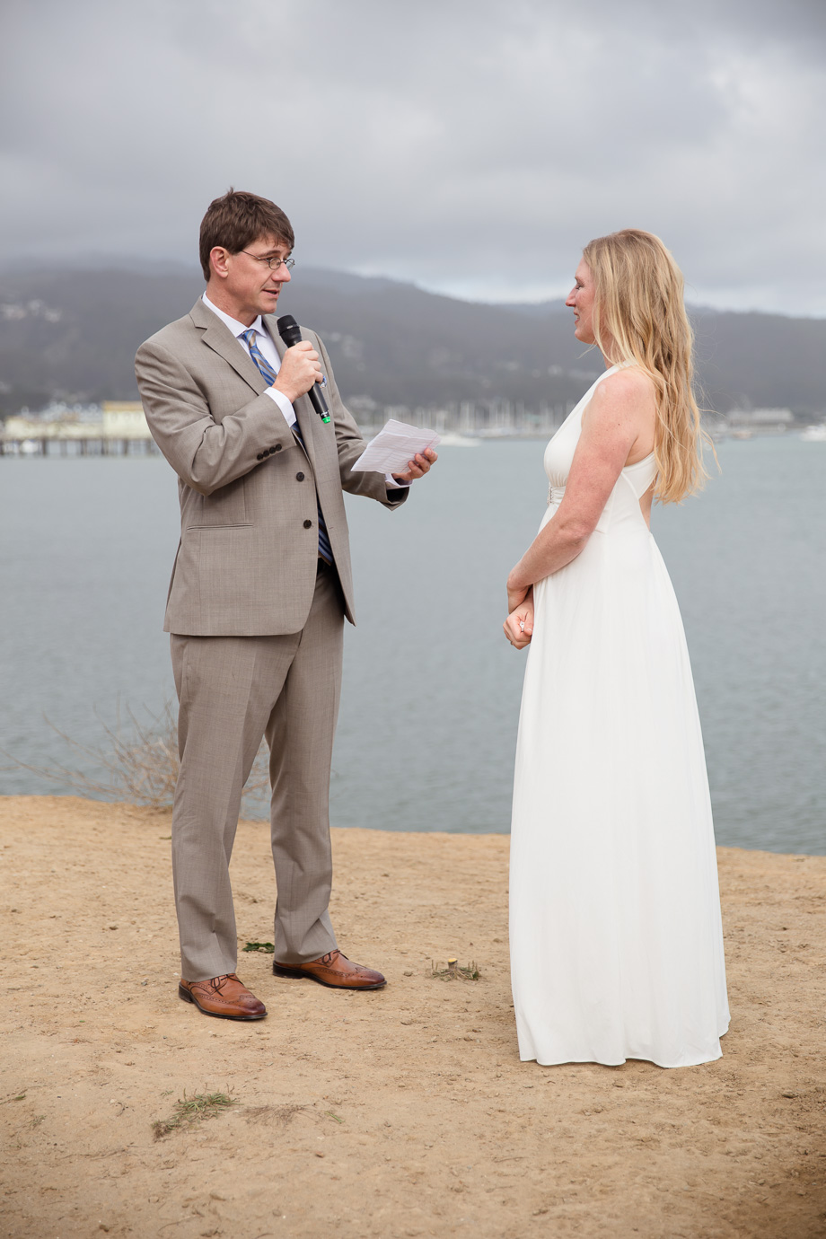 Groom reading his vows on this beautiful Half Moon Bay beach at Princeton-by-the-Sea