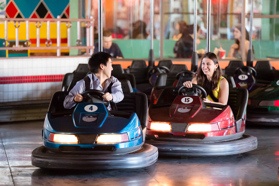 couple bumping into each other on the bumper cars at the Santa Cruz Boardwalk amusement park