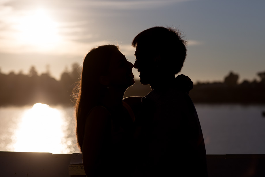 silhouette of newly engaged couple about to kiss at the Santa Cruz Wharf pier