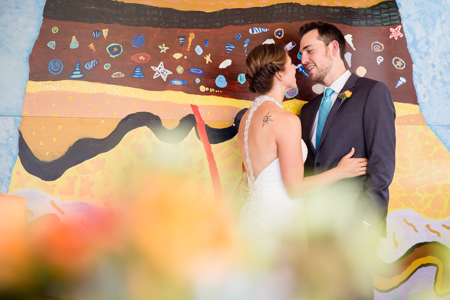 Bold and bright color wall as the backdrop for this colorful wedding portrait at Randall Museum