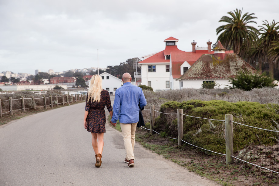 Romantic walking engagement photo at Crissy Field, San Francisco