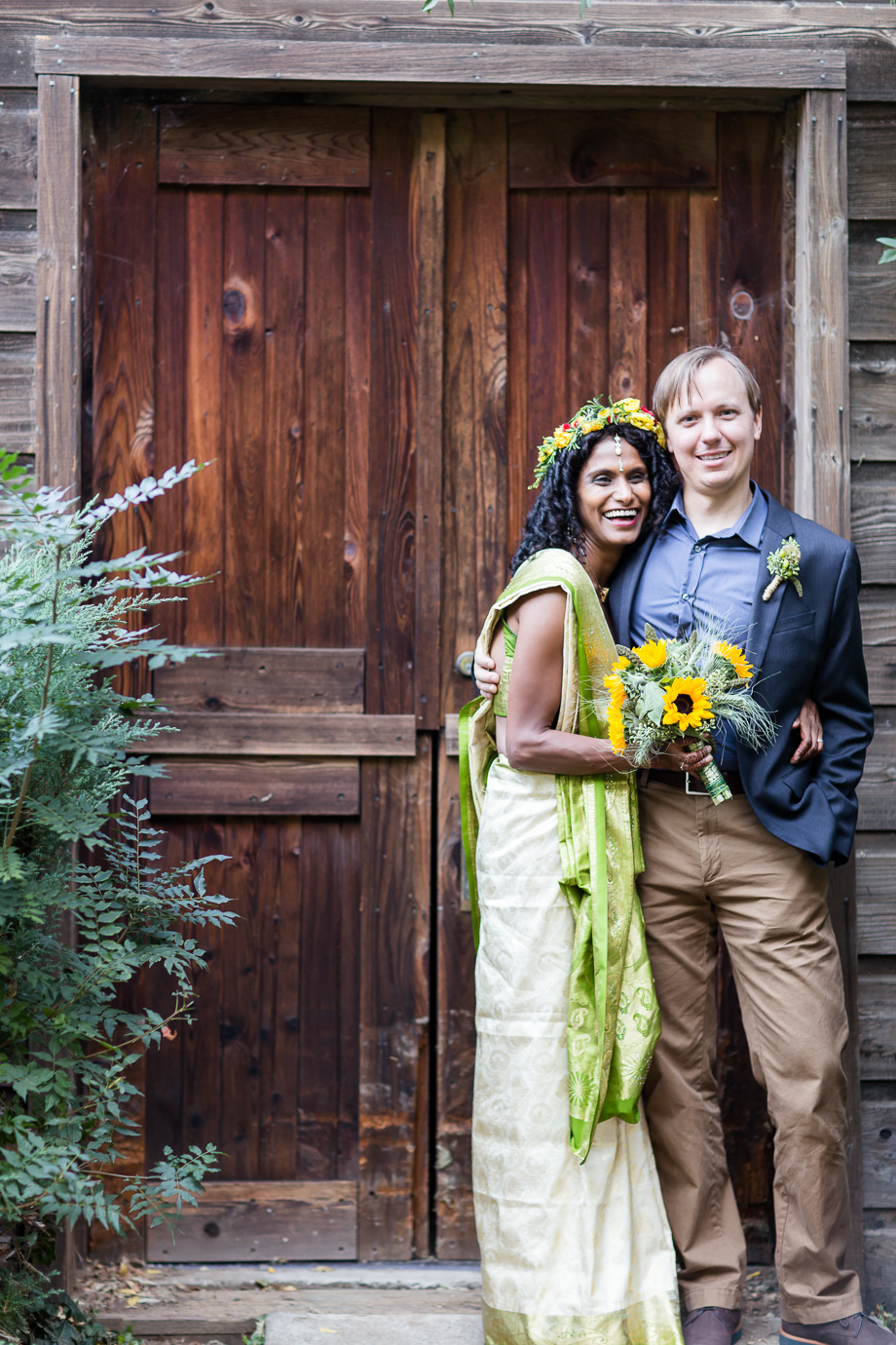 Portrait of the newlywed couple in front of the New Alamaden Quicksilver Mining Museum shaft