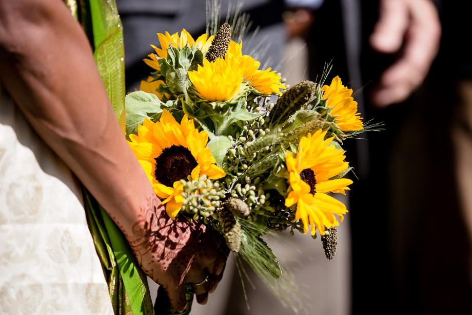 Bride holding her bridal sunflower bouquet