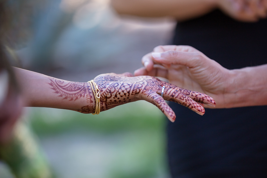 beautiful henna art on hand of the bride