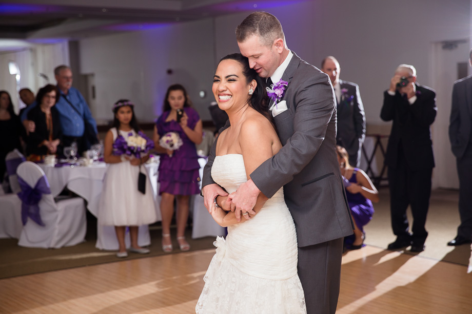 Beautiful couple enjoying their first dance as husband and wife at the Coundary Oak Golf Club