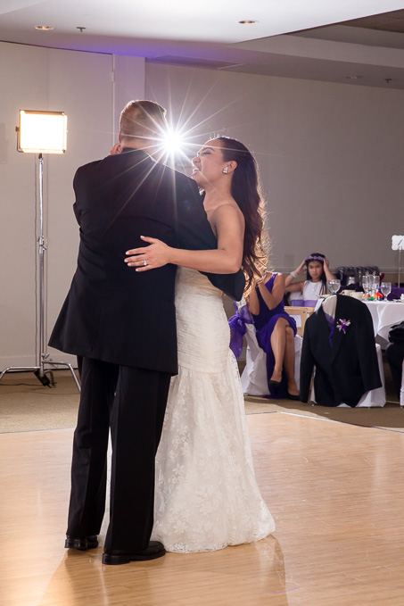 bride and her father dancing on the natural wood dance floor during wedding reception