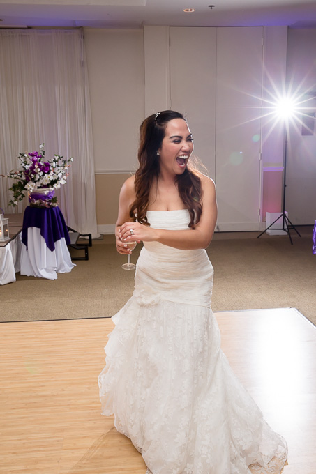 bride laughing on the dance floor during wedding reception