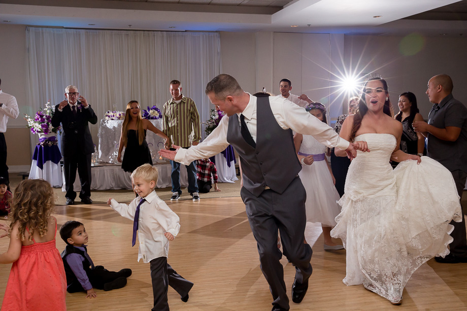 Bride and groom dancing with the kids during wedding reception at Boundary Oak Golf Club