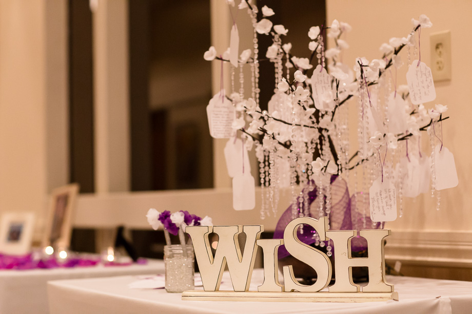 wedding table with a wish tree and paper leaves as guest sign-in table