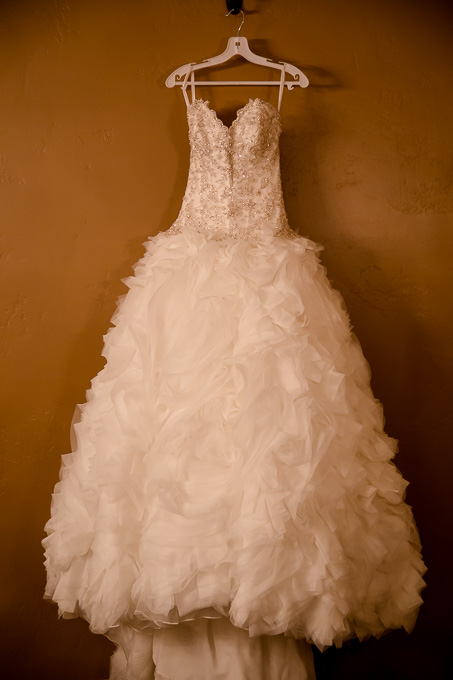 romantic ruffle wedding dress hanging in the bridal suite at Casa Real