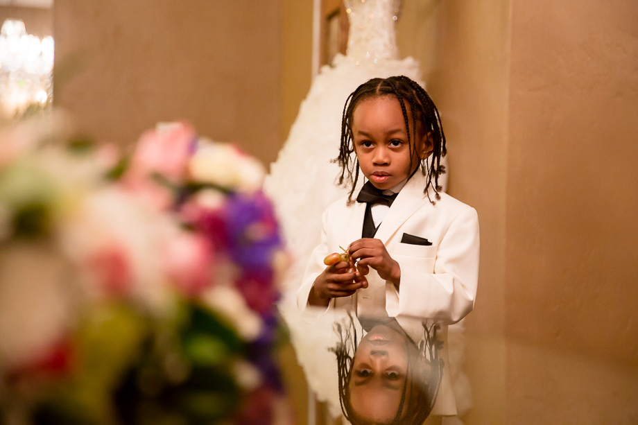 Little ring bearer looking at the bride