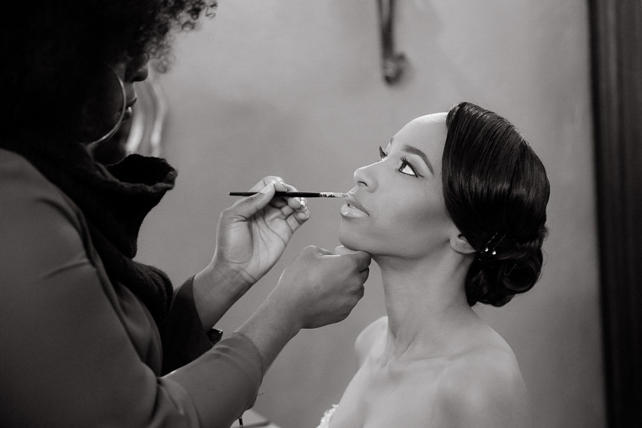 bride having her makeup done before the ceremony - pleasanton real wedding