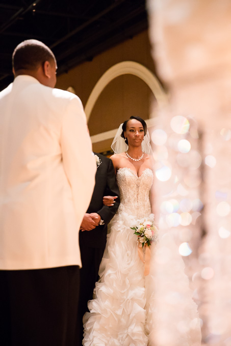 Bride with the ceremony chandeliers