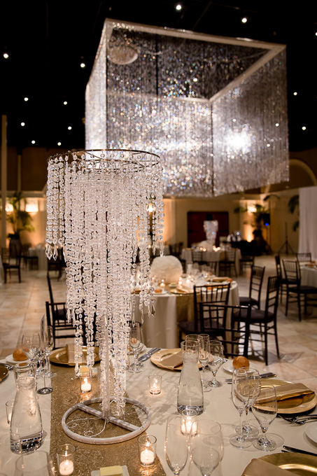 glamrous centerpiece under the fabulous chandelier hanging over the dance floor