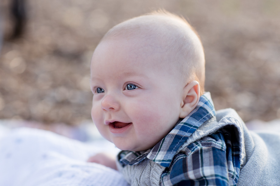 3 month old smiling baby boy with big blue eyes - Vasona park