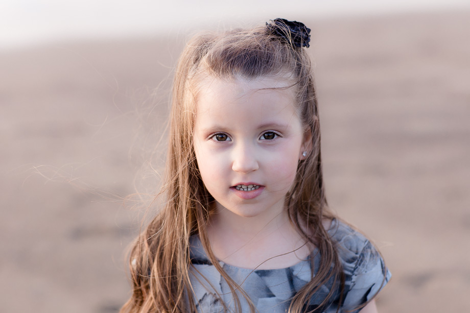 4 year-old girl natural light portrait on the beach at sunset