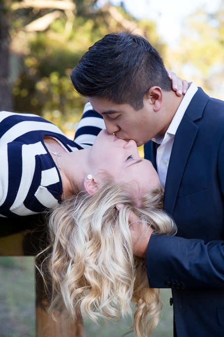 Romantic engagement kissing photo