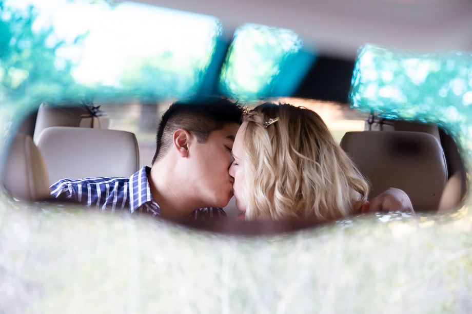 A romantic mirror shot of couple kissing in the back seats of the car - san francisco engagement photography