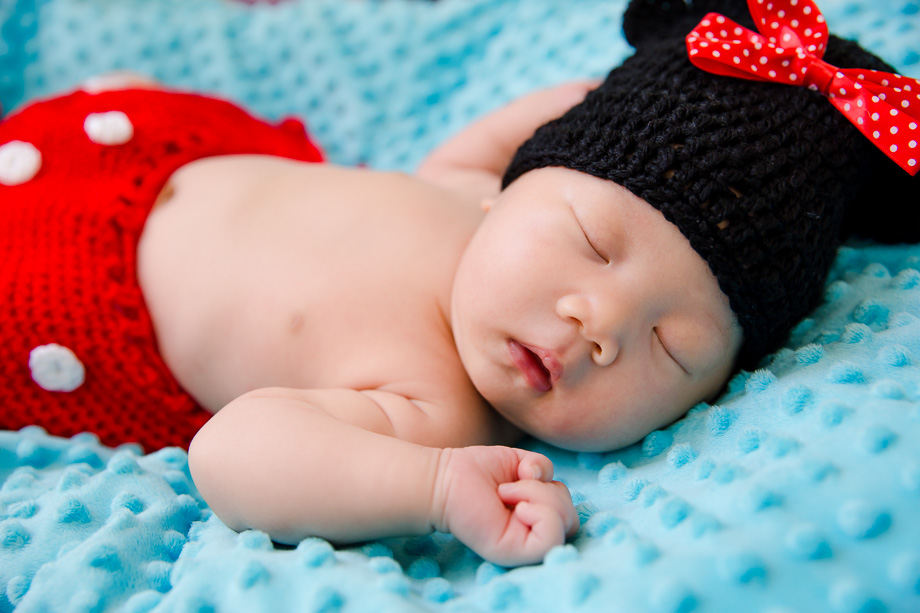 baby girl sleeping in a minnie mouse costume