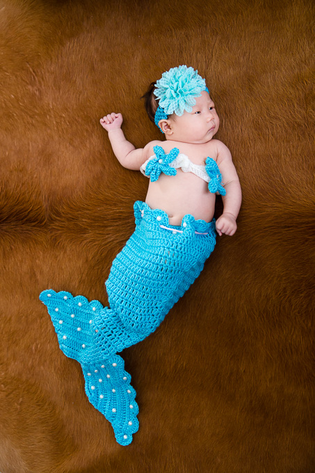 newborn photo in a mermaid costume