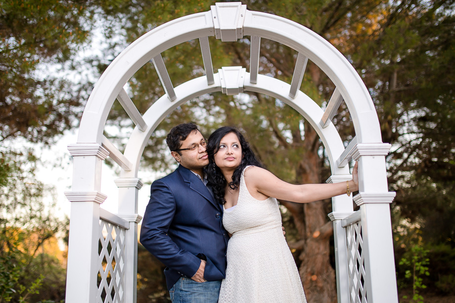 beautiful engagement photos taken under the arch at rengstorff house