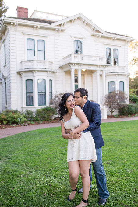 romantic engagement photo at the front lawn of the rengstorff house