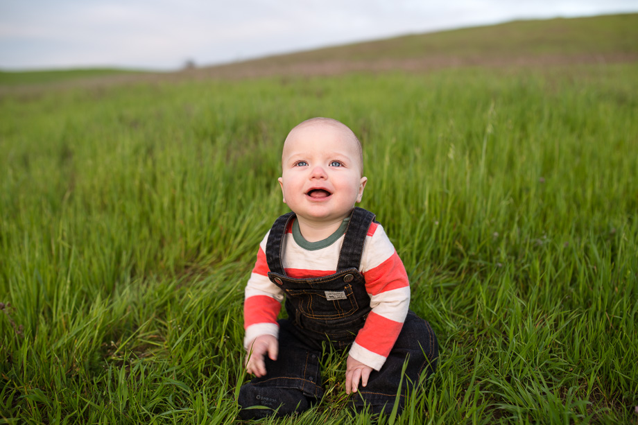 cute baby picture in the grass field