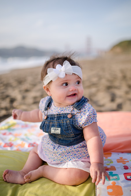 Adorable baby girl portrait at baker beach
