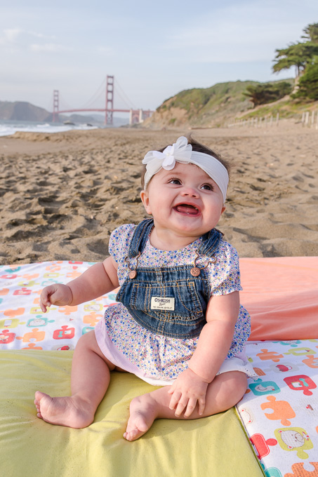 cute 6 month old girl in front of golden gate bridge